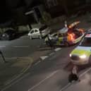 A still from a video uploaded by X account UB1UB2 West London (Southall) of a cow being rammed by a police car in Feltham on June 14, 2024 