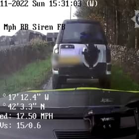 Land Rover driver reverse rams police car.