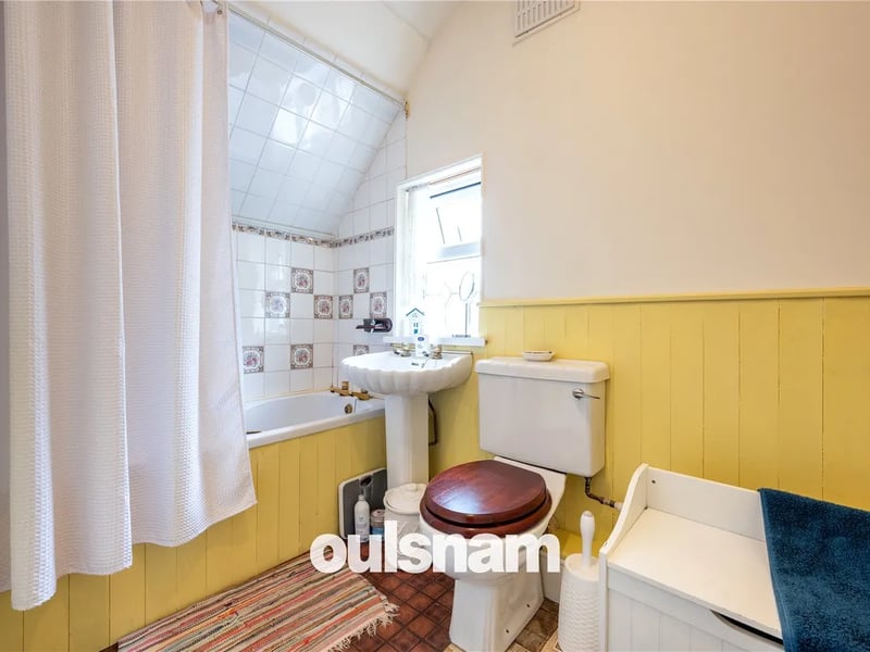The bathroom is fitted with a suite which comprises bath with electric shower over, pedestal wash hand basin and low level wc;