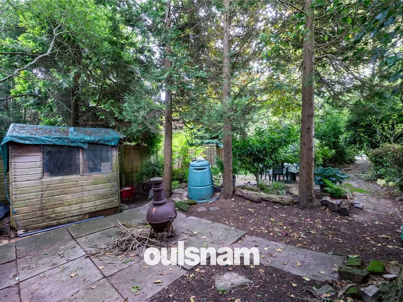 The rear garden is enclosed by panelled fencing to all sides and features a huge selection of mature shrubs and trees which offer a high degree of privacy