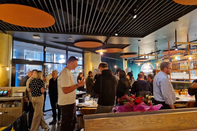 Stylish setting with an outdoor dining terrace, cozy bar and two distinct dining sections
