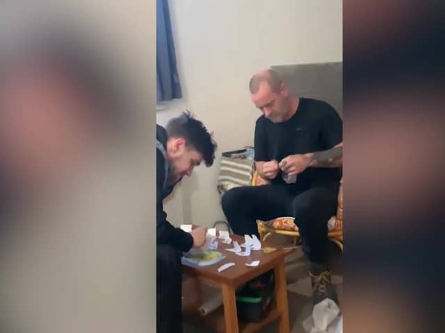 Video grab from footage as Police have mocked a group of dopey dealers who were caught after they videoed themselves bagging up illegal drugs.