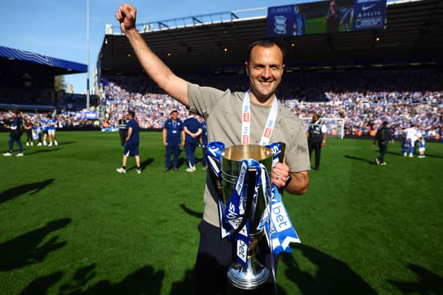 Chris Davies, Manager of Birmingham City, celebrates with the EFL Sky Bet League One Trophy following victory in the Sky Bet League One match between Birmingham City FC and Mansfield Town FC at St Andrewâs at Knighthead Park on April 27, 2025 in Birmingham, England. (Photo by Mark Thompson/Getty Images)