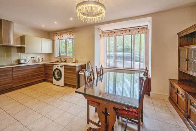 A quiet cul-de-sac setting with driveway and garage parking makes this Birmingham family home instantly appealing