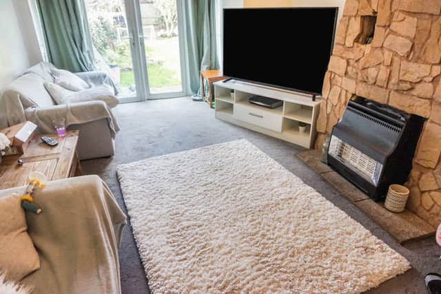 One of the two spacious reception rooms, providing a flexible living area with plenty of natural light