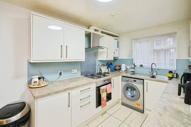 A modern fitted kitchen positioned at the rear of the property, designed for everyday family life and easy entertaining