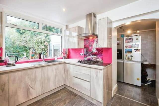 A fitted kitchen with adjoining utility space, designed for practical everyday family living