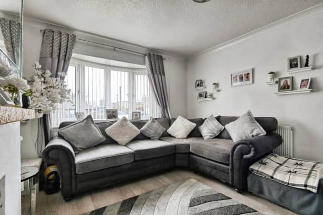 A bright and comfortable lounge that provides a welcoming main living space filled with natural light