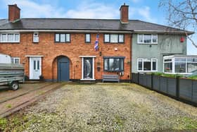 A tidy mid-terrace home set back from the road with the added benefit of off-road parking
