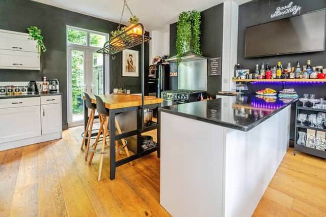 A high-spec kitchen with statement appliances and room for relaxed family dining