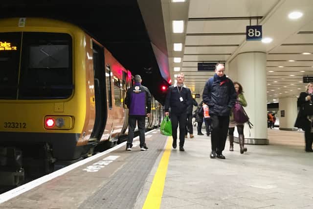West Midlands Railway train on platform at Birmingham New Street - taking express trains out leaves more room for local services