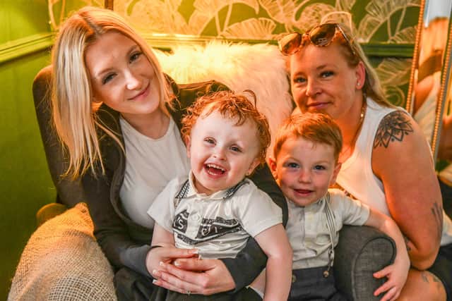 Meire Higgins with son Grayson and Jodie Higgins with son Roux