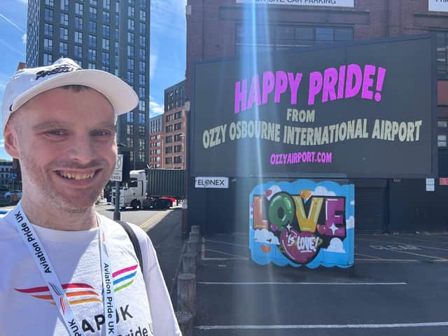 Ozzy Airport Campaigner Dan Hudson with his Birmingham Pride billborad