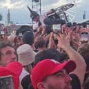 A wheelchair user crowd surfing at Download festival.