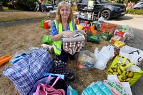 Volunteer Vi Wood with just some of the many donations.
Tim Thursfield/Iconic Media Group
