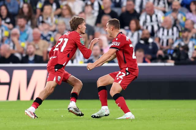 Isaac Price wheels away in celebration at Newcastle.