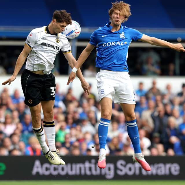 Ladislav Krejci heads the ball under pressure from August Priske