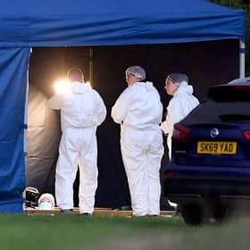 Grave exhumation work taking place at Fenns Meadow Green Burial Ground, Whitchurch due to a police investigation