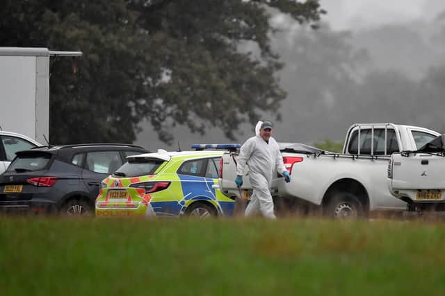 Officers in forensics gear worked overnight