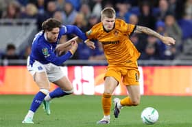 Wolves midfielder Jordan James, right