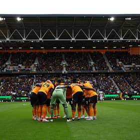 Wolves players in a huddle at Molineux