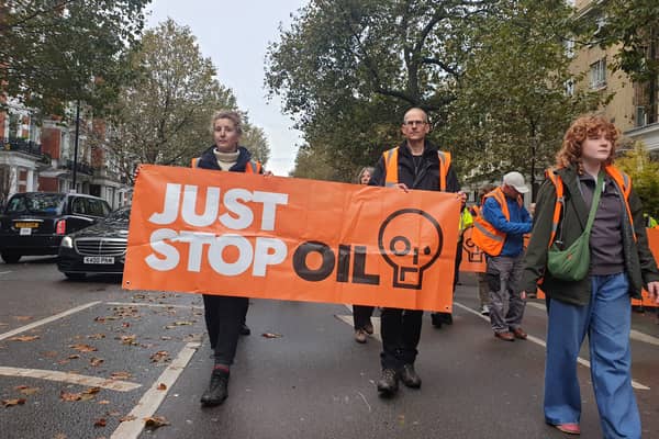 Jamie Russell, right, taking part in the protest on November 1, 2023.