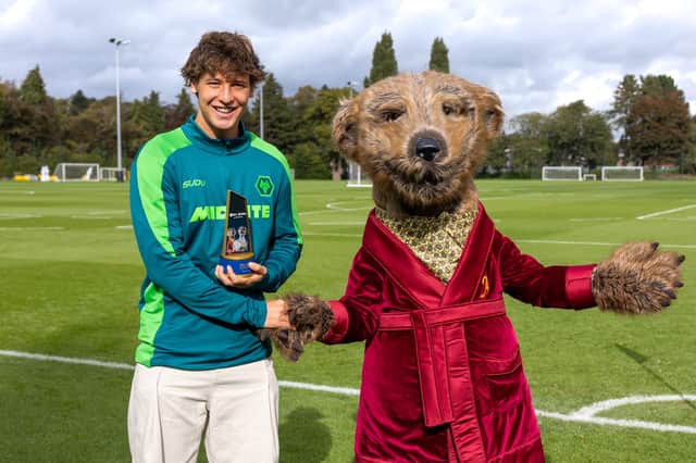 Fer Lopez (left) was presented with his Goal Hero of the Month award by Aleksandr, Compare the Market’s iconic meerkat.