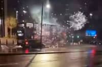 A bus in Birmingham, under attack from somebody shooting fireworks at it.