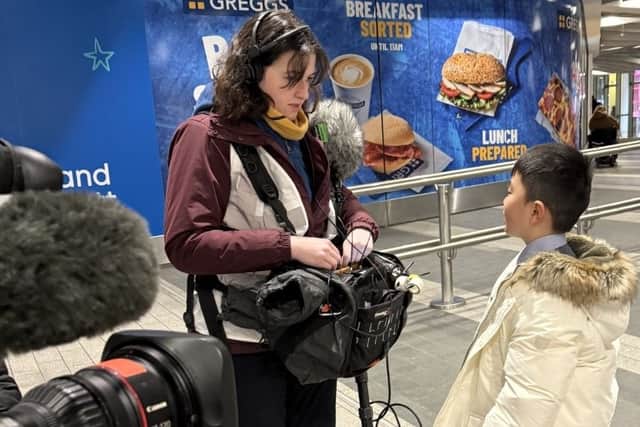 Bowen speaking to a camera operator during filming of The Piano