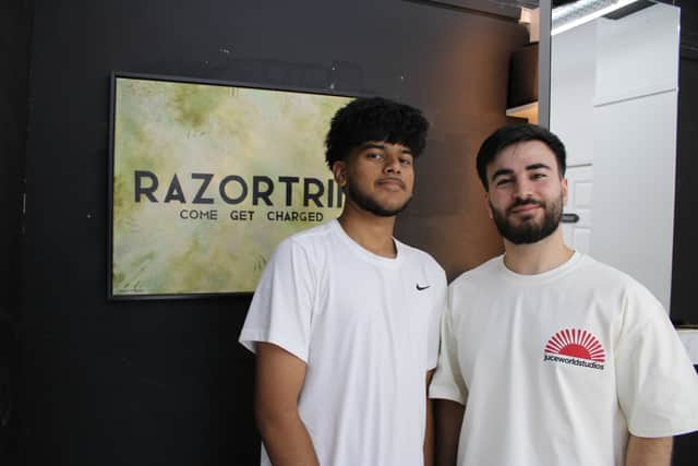 Barbershop owner Razwan Amin with Esa Kansara, one of the Erdington Academy students who have already had a free haircut at his studio