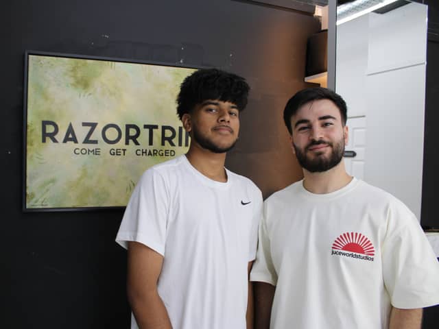 Barbershop owner Razwan Amin with Esa Kansara, one of the Erdington Academy students who have already had a free haircut at his studio