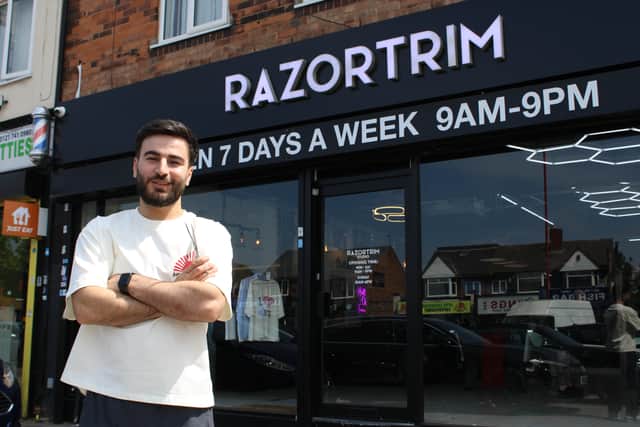 Razwan Amin outside his studio, Razortrim, which is offering free haircuts to student who receive free school meals