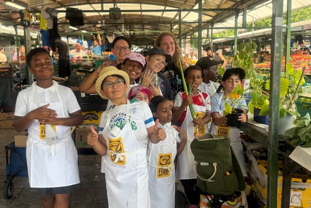 Children proudly display their produce at Bullring Open Market