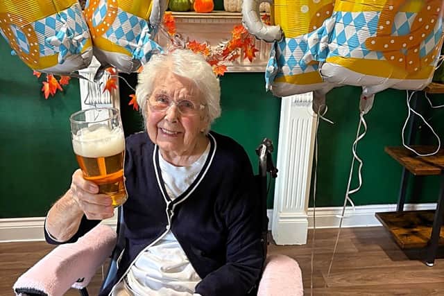 Bishops Manor resident Doreen ‘Babs’ Boyden, taking part in the beer-tasting activity