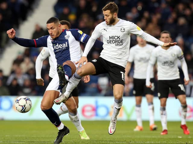 Jorge Grant of Peterborough United in action with Jake Livermore of West Bromwich Albion. Photo: Joe Dent/theposh.com.