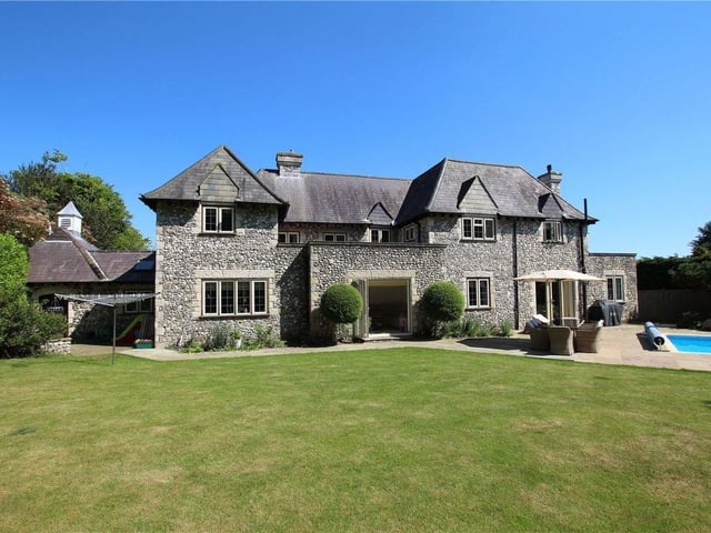 The garden includes a variety of ornamental trees and shrubs, according to the Zoopla listing SUS-220202-155744001