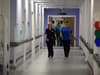 Queen Elizabeth Hospital turns offices into wards as patient waiting times spike