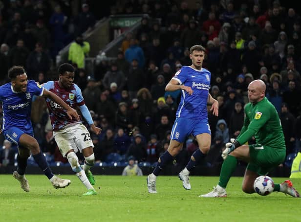 <p>BURNLEY, ENGLAND - DECEMBER 27: Nathan Tella of Burnley scores their side's third goal past John Ruddy of Birmingham City during the Sky Bet Championship between Burnley and Birmingham City at Turf Moor on December 27, 2022 in Burnley, England. (Photo by Cameron Smith/Getty Images)</p>