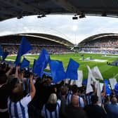 HUDDERSFIELD, ENGLAND - AUGUST 05: Huddersfield Town fans wave flags prior to the Sky Bet Championship match between Huddersfield Town and Derby County at John Smith's Stadium on August 05, 2019 in Huddersfield, England. (Photo by George Wood/Getty Images)