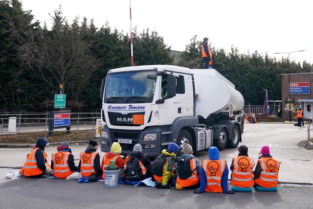 Four protestors were arrested by police following the protests in Hedge End and New Forest. Pictured is a group of activists from Just Stop Oil blocking the route of a tanker, as they blockade the ESSO Birmingham Fuel Terminal, Birmingham. Picture date: Friday April 1, 2022. Picture: Joe Giddens/PA Wire.