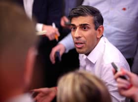 Prime Minister Rishi Sunak holds a "huddle" press conference with political journalists on board a Government plane as he heads to Bali, in Indonesia to attend the G20 summit. Picture date: Sunday November 13, 2022.