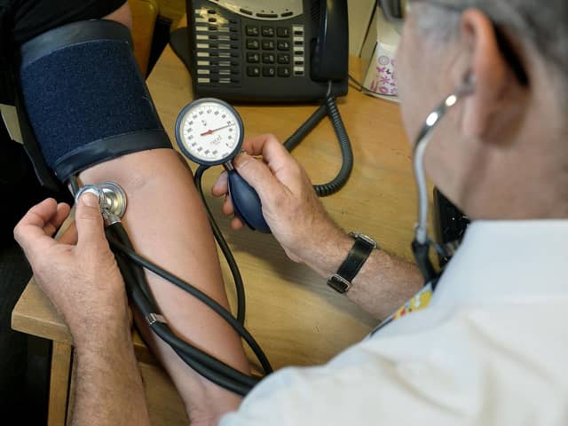 These are the best GPs in Solihull. File photo of a GP at work (Picture: Anthony Devlin/PA Wire)
