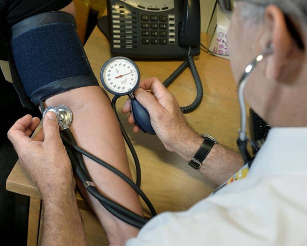 These are the best GPs in Solihull. File photo of a GP at work (Picture: Anthony Devlin/PA Wire)