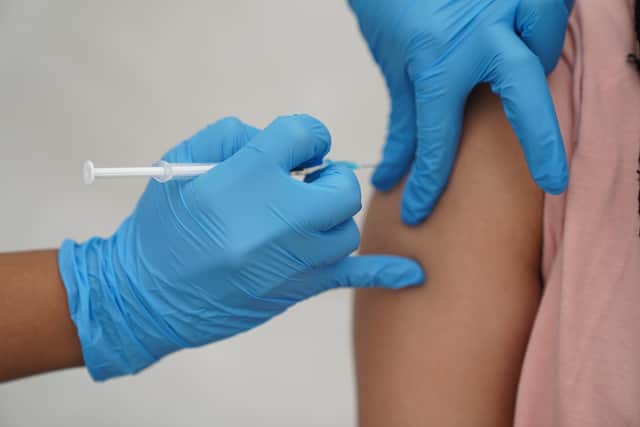 A person pictured receiving a Covid-19 jab. Coronavirus booster vaccine jabs for millions of people in England will begin to be offered this week, the NHS has announced. The vaccine will be available to care home residents, people who are 75 and over, and the immunosuppressed aged 12 and over.