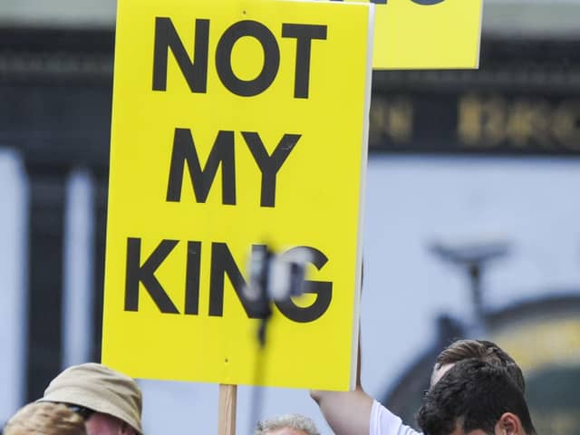 Anti-monarchy protesters before for the National Service of Thanksgiving and Dedication for King Charles III and Queen Camilla. Picture: Lisa Ferguson