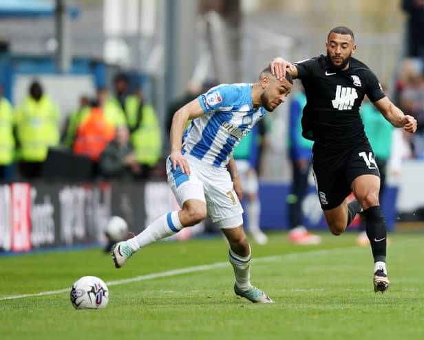 Huddersfield Town's Brodie Spencer battles for possession with Birmingham City's Keshi Anderson during the Sky Bet Championship match at John Smith's Stadium. Photo: Jess Hornby/PA Wire.