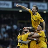 Wolves players celebrate Photo by David Rogers/Getty Images.