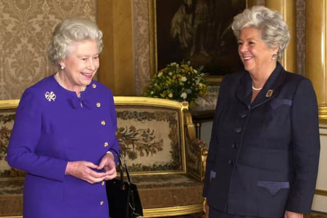 File photo dated 11/10/00 of Queen Elizabeth II (left) sharing a joke after she receiving the Rt Hon Betty Boothroyd, MP, Speaker of the House of the Commons, in a farewell Audience at Buckingham Palace in London.