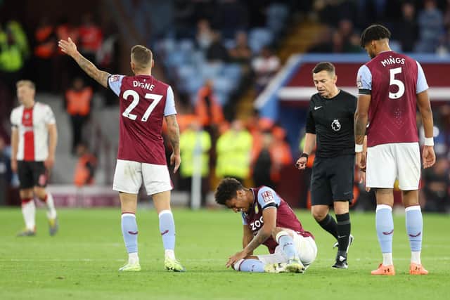 BIRMINGHAM, ENGLAND - SEPTEMBER 16: Boubacar Kamara of Aston Villa reacts after picking up an injury leading to them being substituted during the Premier League match between Aston Villa and Southampton FC at Villa Park on September 16, 2022 in Birmingham, England. (Photo by Catherine Ivill/Getty Images)