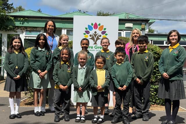 Headteacher Kristal Brookes, Deputy Headteacher Lucia Wilder and children from Mere Green Primary School, which has received a glowing Ofsted report.